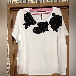 White Blouse with Black Embroidery Design on top.